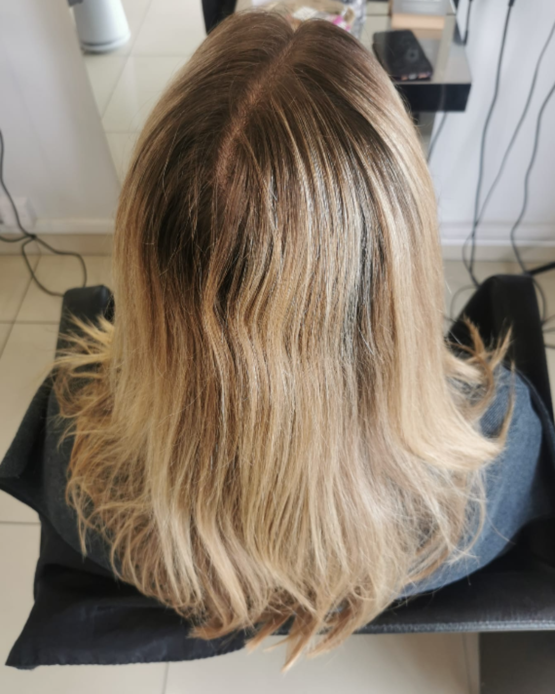 Natural regrowth and previous blonde before the colour refresh Natural regrowth and previous blonde before the colour refresh